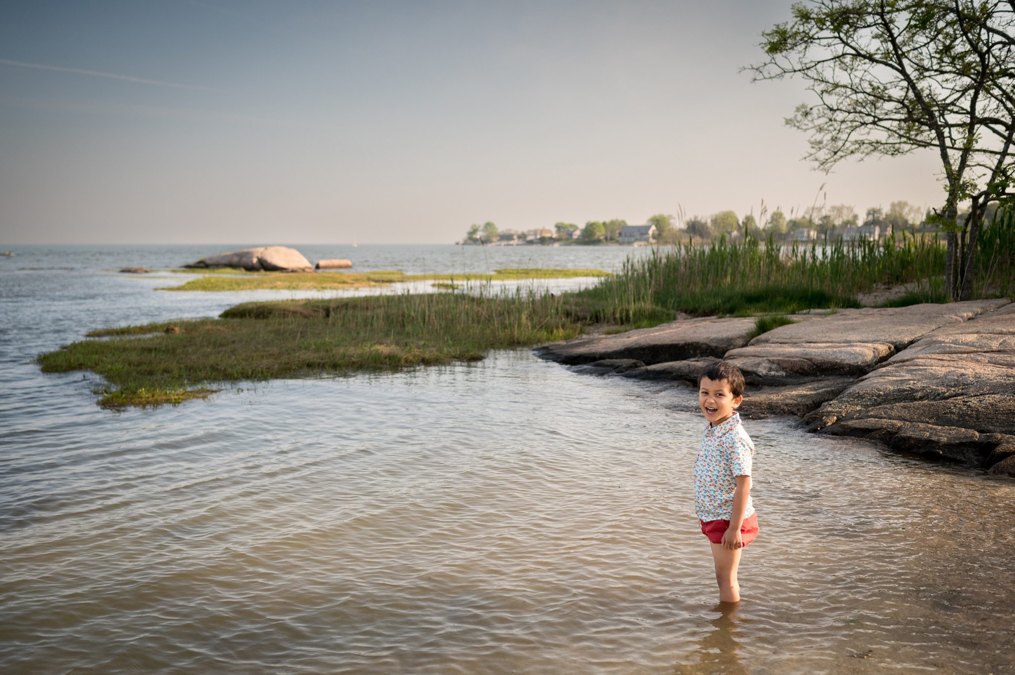 Boy wading in water