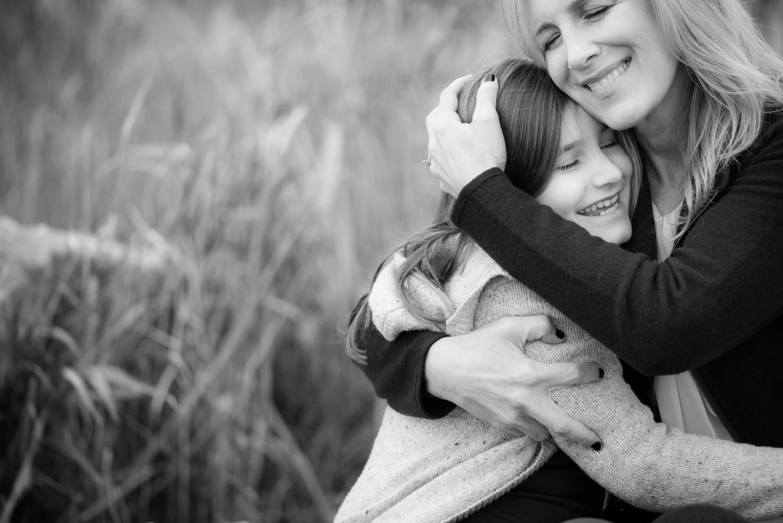 Mom hugging teen daughter